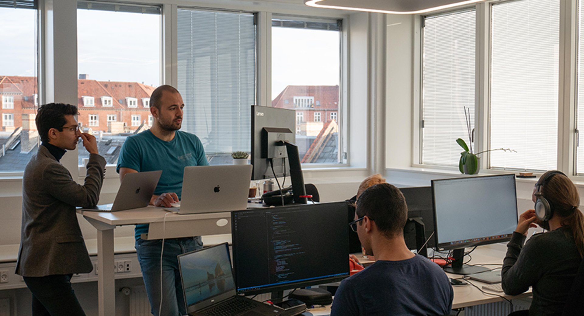people looking at performance dashboards